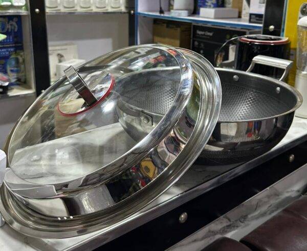 Multi-purpose cooking pot suitable for induction, gas, and electric stovetops.