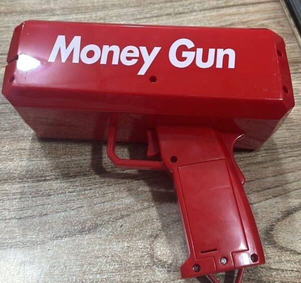 Money Gun Toy shooting fake bills, creating a fun party atmosphere.