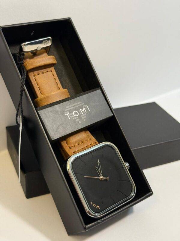 Stylish TOMI Square Dial Watch with tan leather strap, perfect for both casual and formal outfits.