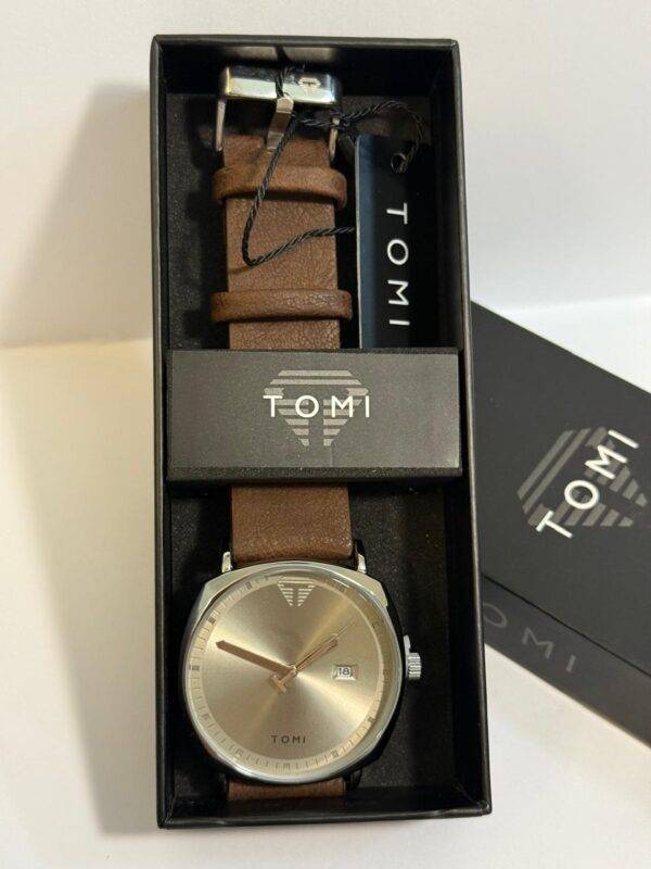 TOMI Classic Watch with sleek, minimal dial and leather strap, presented in branded box.