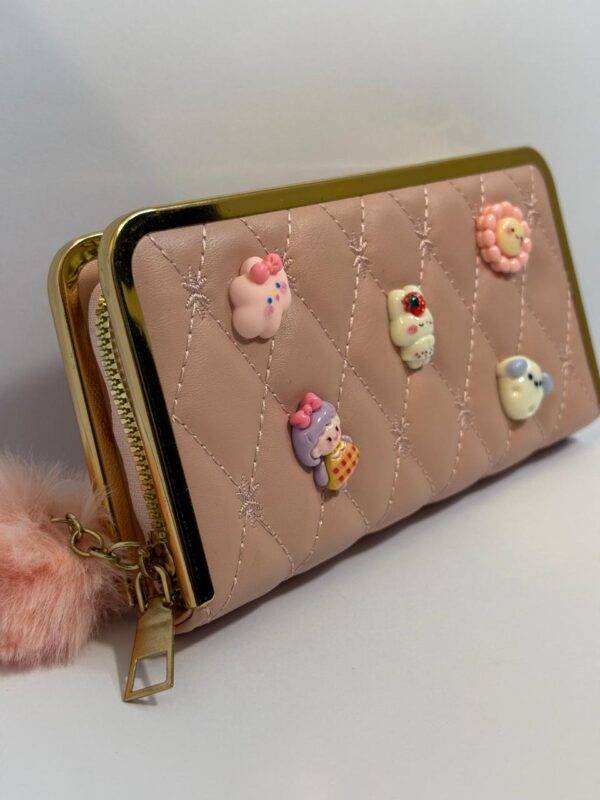 Side view of the pink quilted wallet